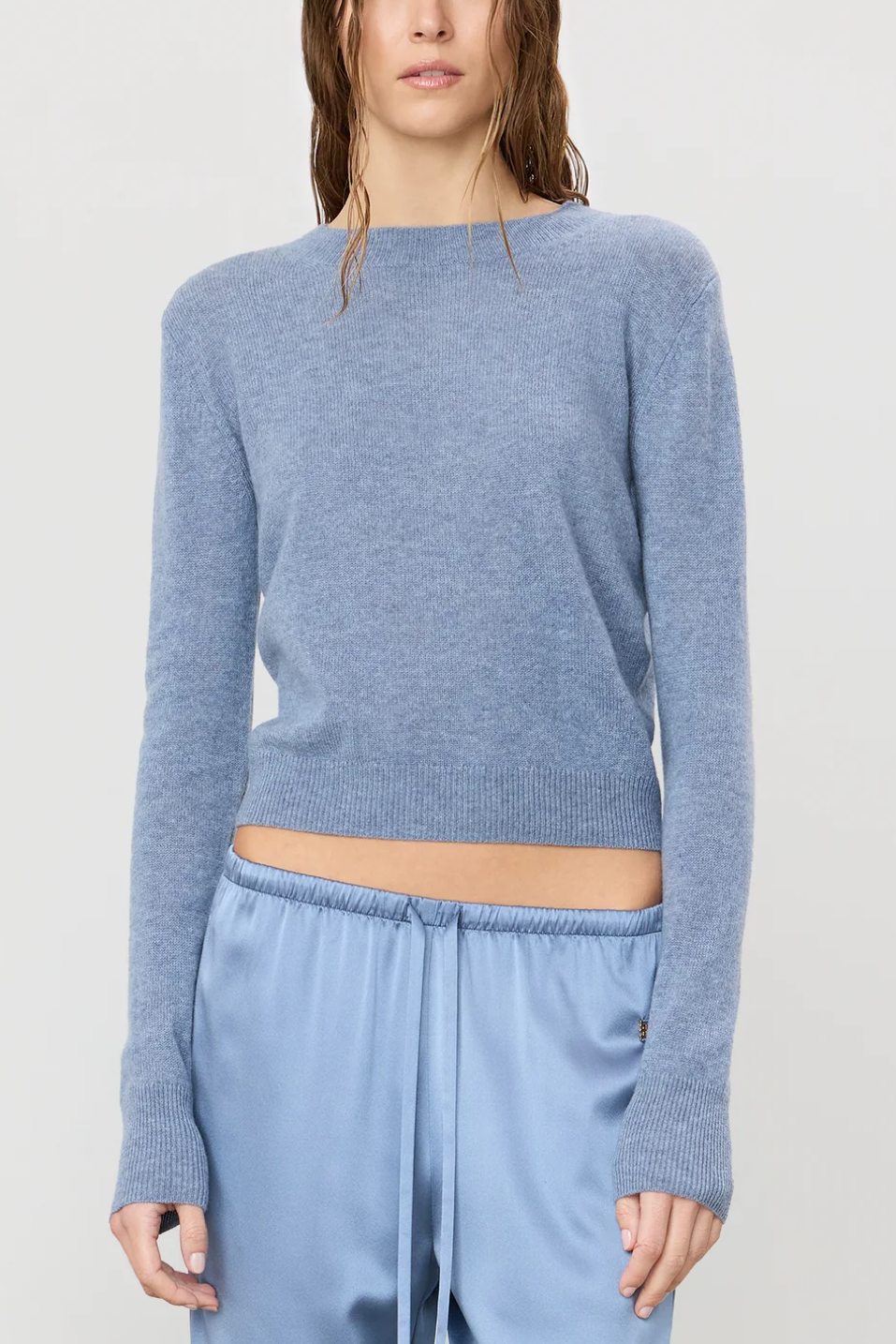 Women wearing a slate color sweater 