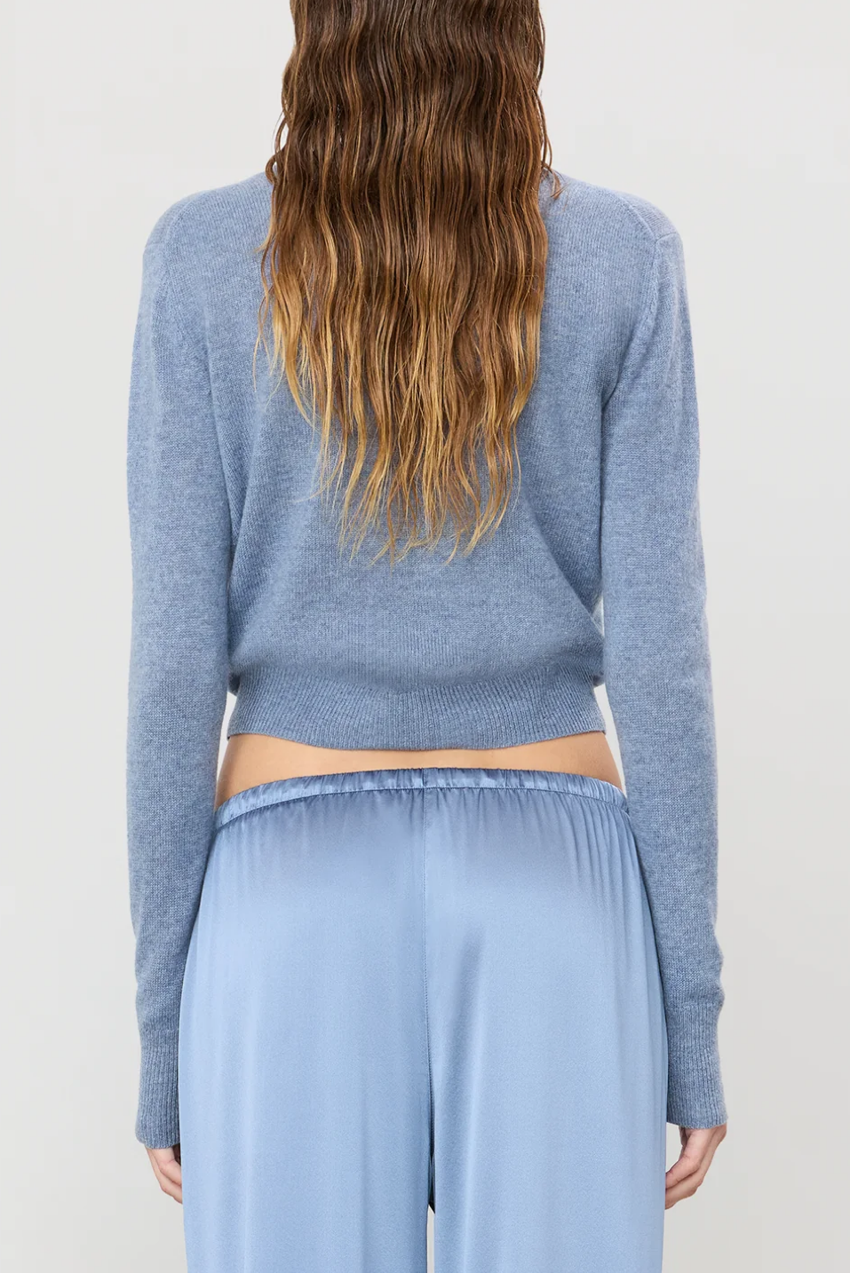 Back of a slate colored sweater 
