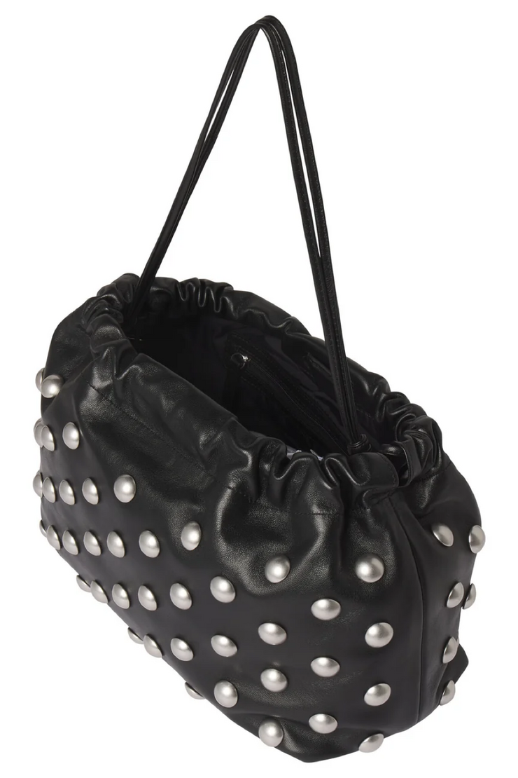 Black studded handbag on a white background