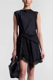 Black sleeveless dress with lace detail on a white background