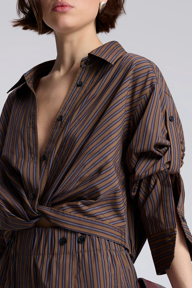 Striped shirt worn by a person on a plain background