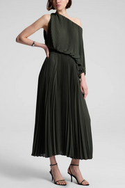 Woman wearing a green one-shoulder dress on a white background