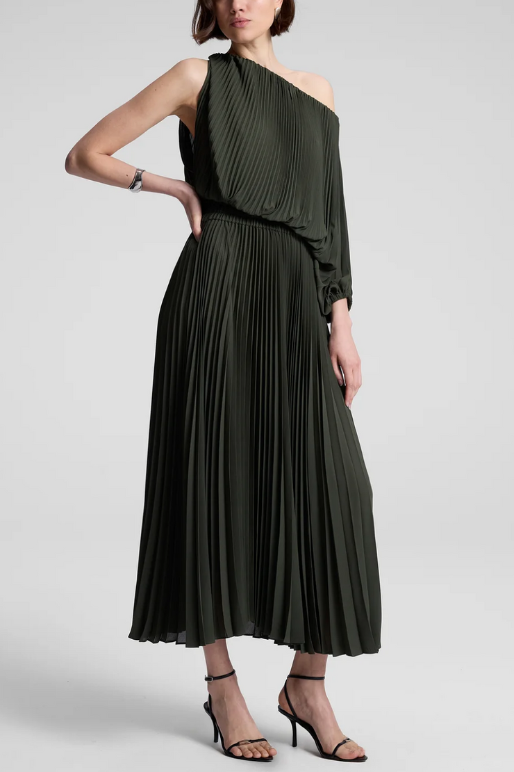 Woman wearing a green one-shoulder dress on a white background