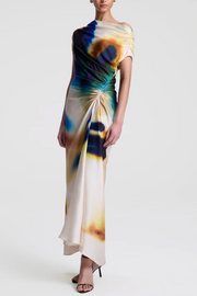 Woman wearing a colorful tie-dye dress on a white background