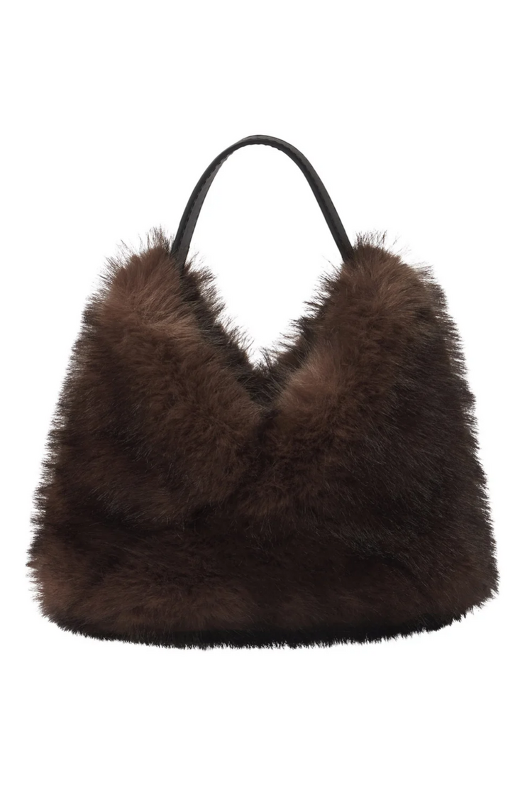 Brown fur handbag on a white background