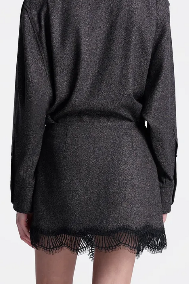 Dark gray sweater with lace trim on a plain background