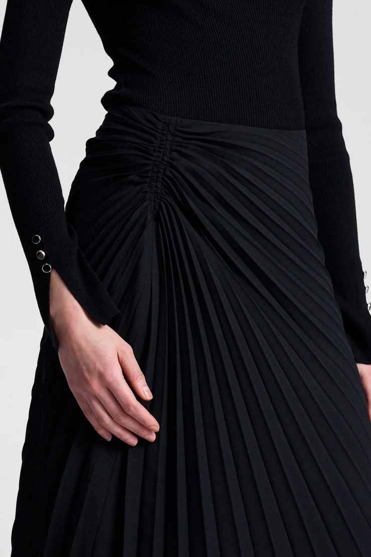 Black pleated skirt on a white background