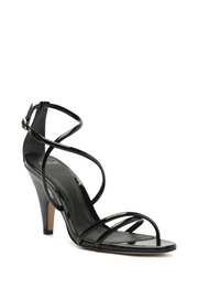 Black high-heeled sandal with thin straps on a white background