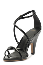 Black high-heeled sandal with criss-cross straps on a white background