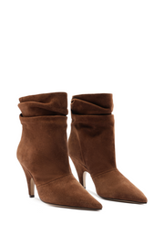 Pair of brown suede ankle boots on a white background