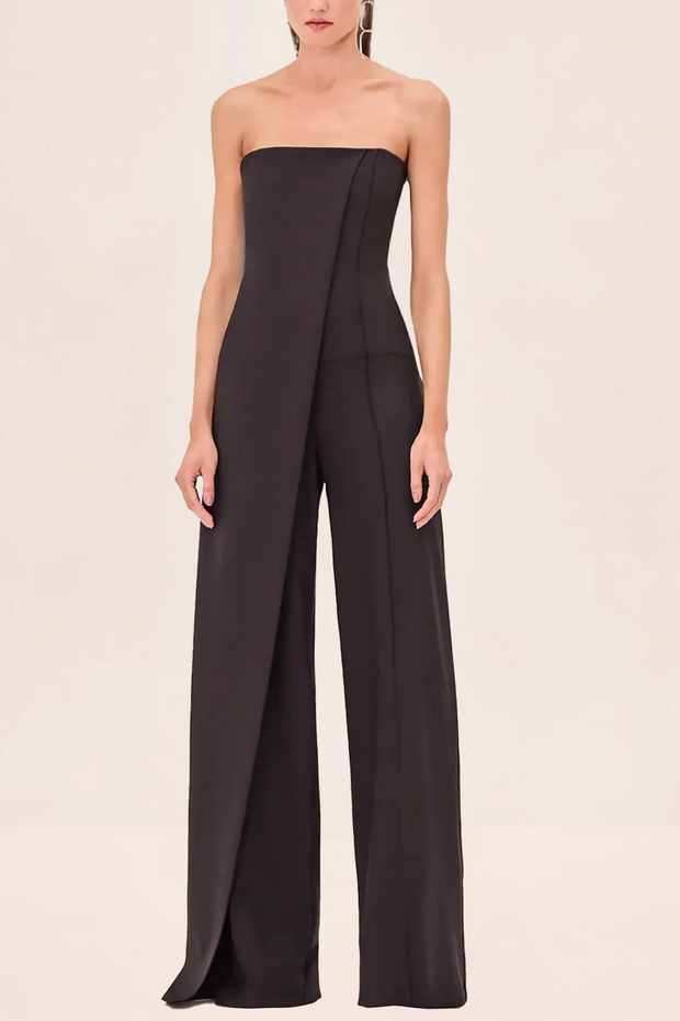 Black strapless jumpsuit on a beige background