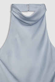 Light blue sleeveless top on a light gray background