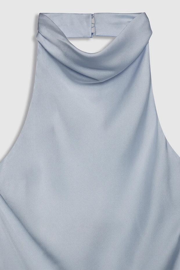 Light blue sleeveless top on a light gray background