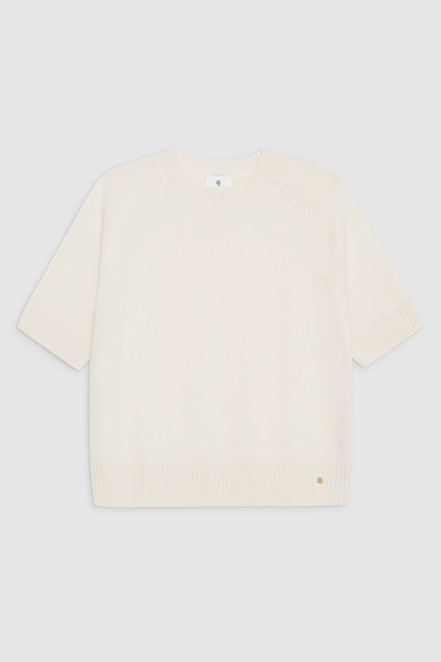 Ivory cashmere sweater on white background