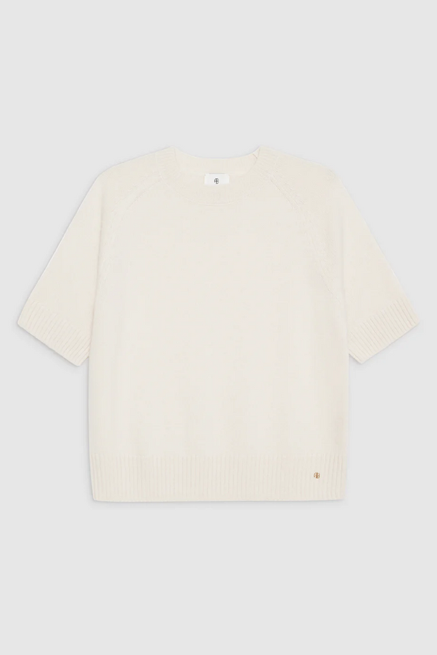 Ivory cashmere sweater on white background