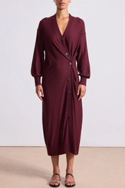 Front image of model wearing a drippy cardigan dress in mulberry