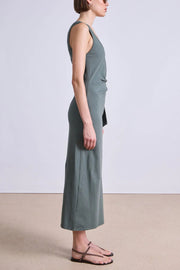 Image of model wearing the Apiece Apart Uri Twist Dress side view