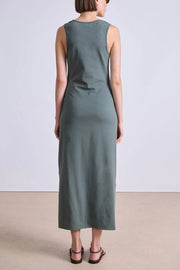 Image of model wearing the Apiece Apart Uri Twist Dress back view