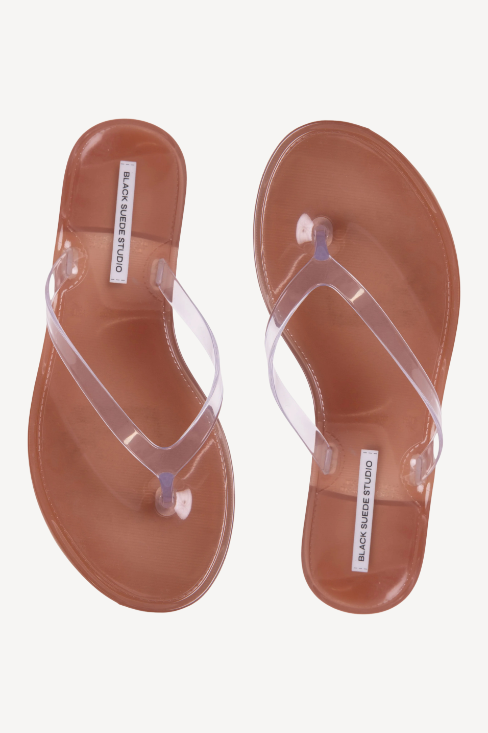 Clear sandals on a plain background 