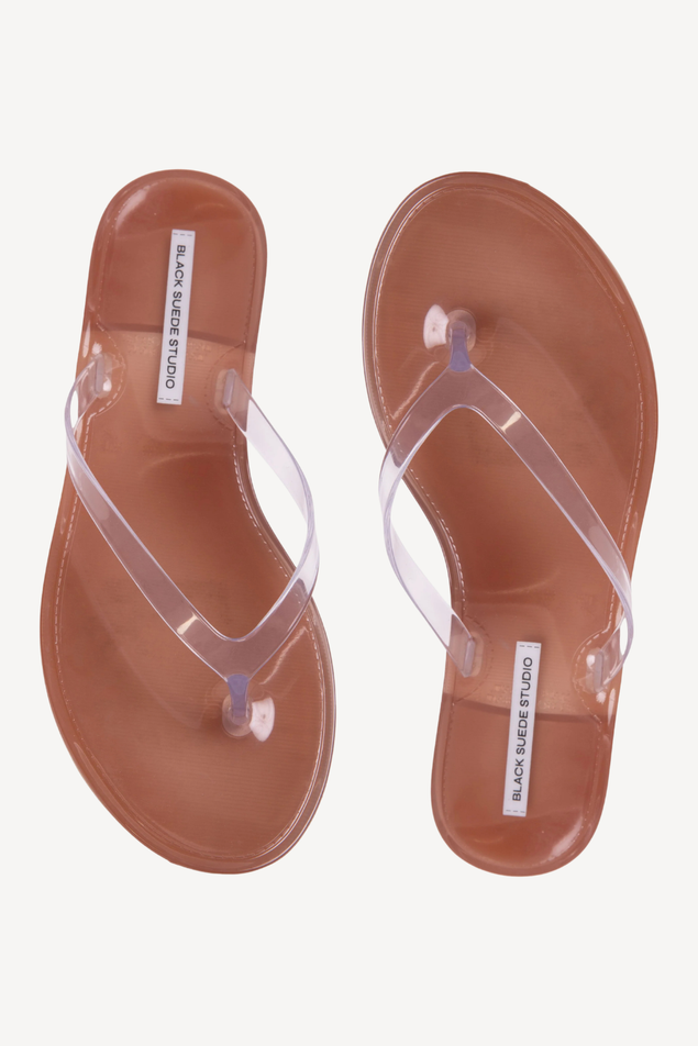 Clear sandals on a plain background 