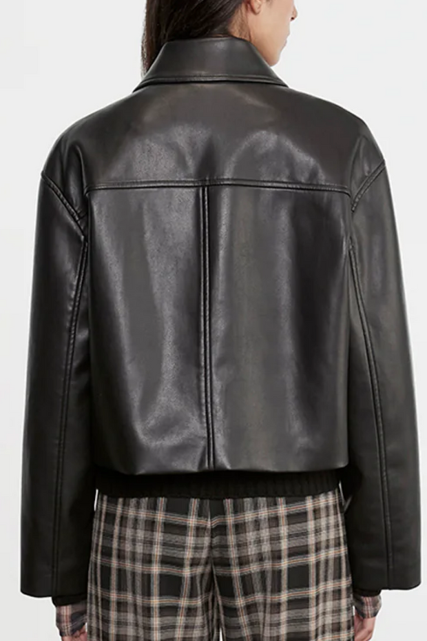 Black leather jacket worn by a person on a white background