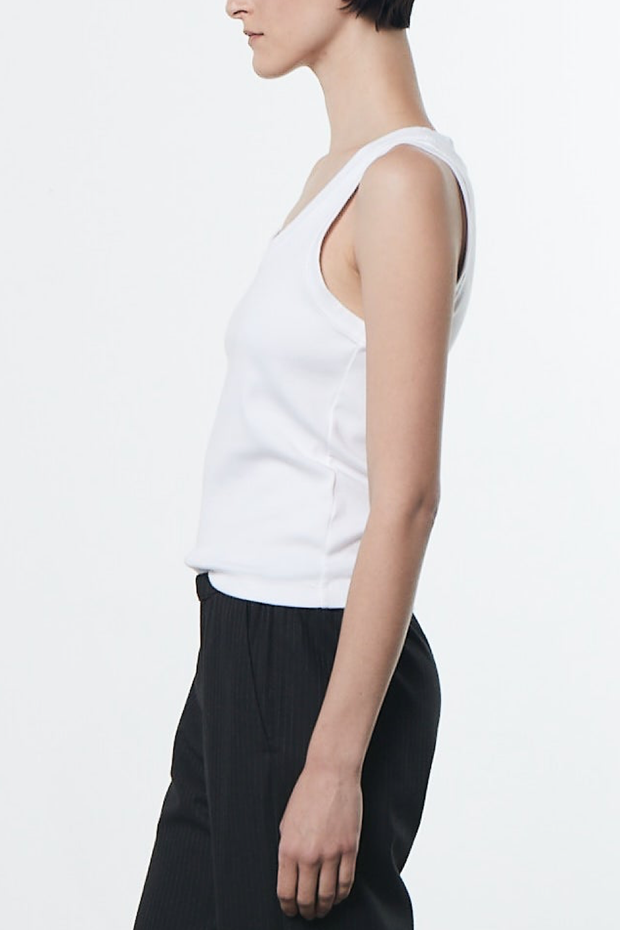 Image of model wearing Enza Costa Supima knit u tank in white
