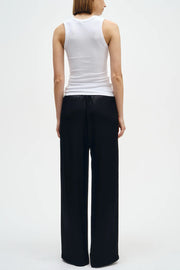 Image of model wearing the Enza Costa Textured Rib Sleeveless U back view