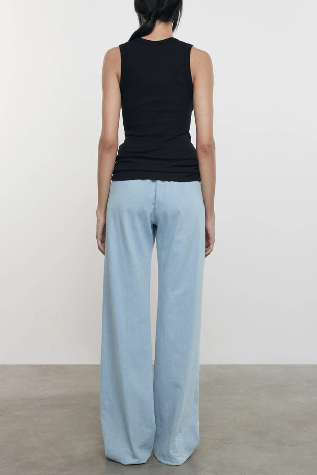 Image of model wearing the Enza Costa Textured Rib Sleeveless U back view