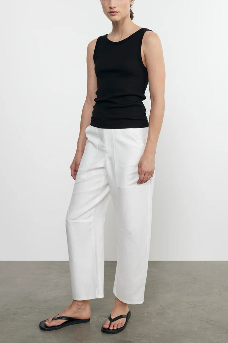 Image of model wearing the Enza Costa Twill Work Pant side angled view