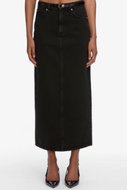 Black denim skirt worn by a person on a white background