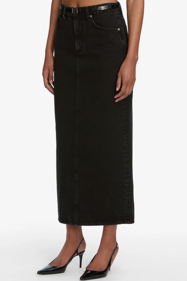 Black denim skirt worn by a person on a white background