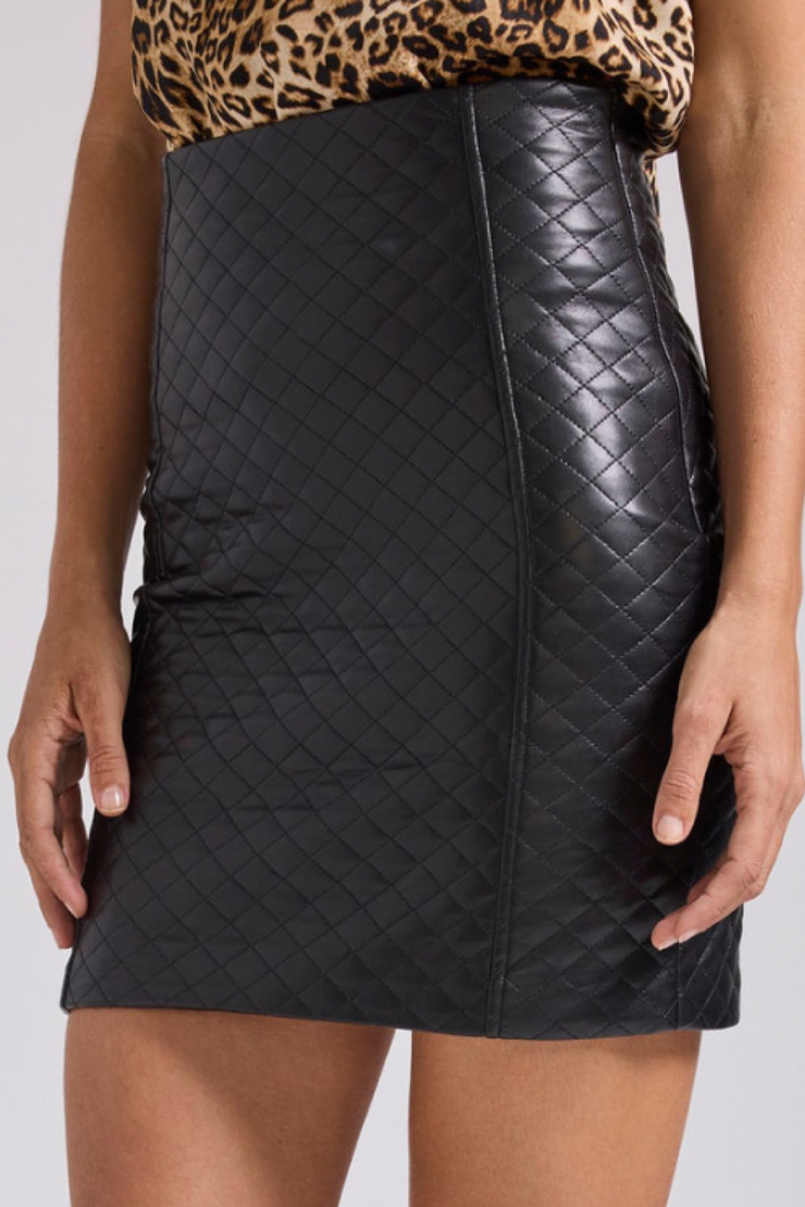 Image of model wearing Generation Love Aiza quilted vegan leather skirt