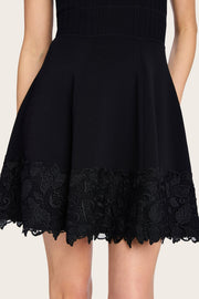 Image of model wearing the Generation Love Orpheus Lace Combo Rib Dress front view close up