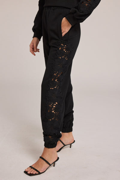 Image of model wearing the Generation Love Winnie Lace Jogger with one hand in pocket