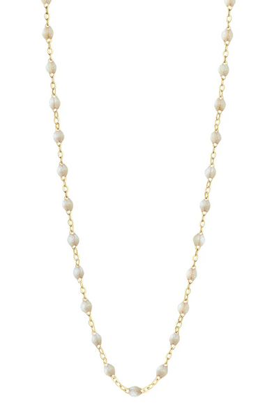 Opal necklace with gold chain on a white background