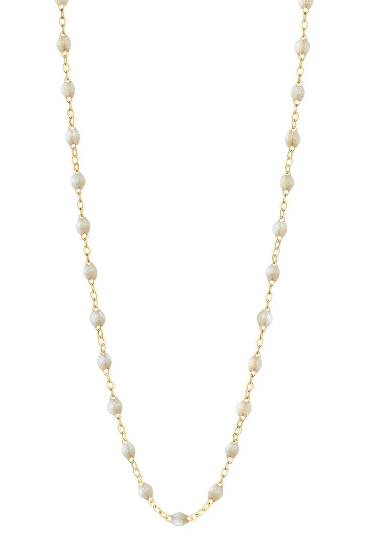 Opal necklace with gold chain on a white background