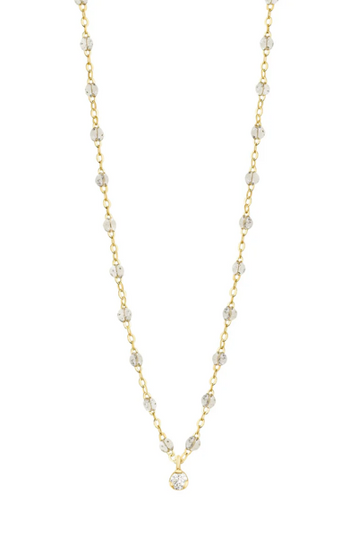 Gold and sparkle beaded necklace on a white background