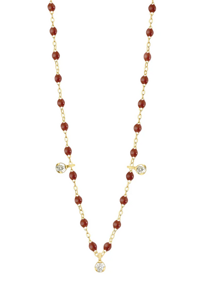 Necklace with moka beads, 3 diamonds and gold chain on a white background