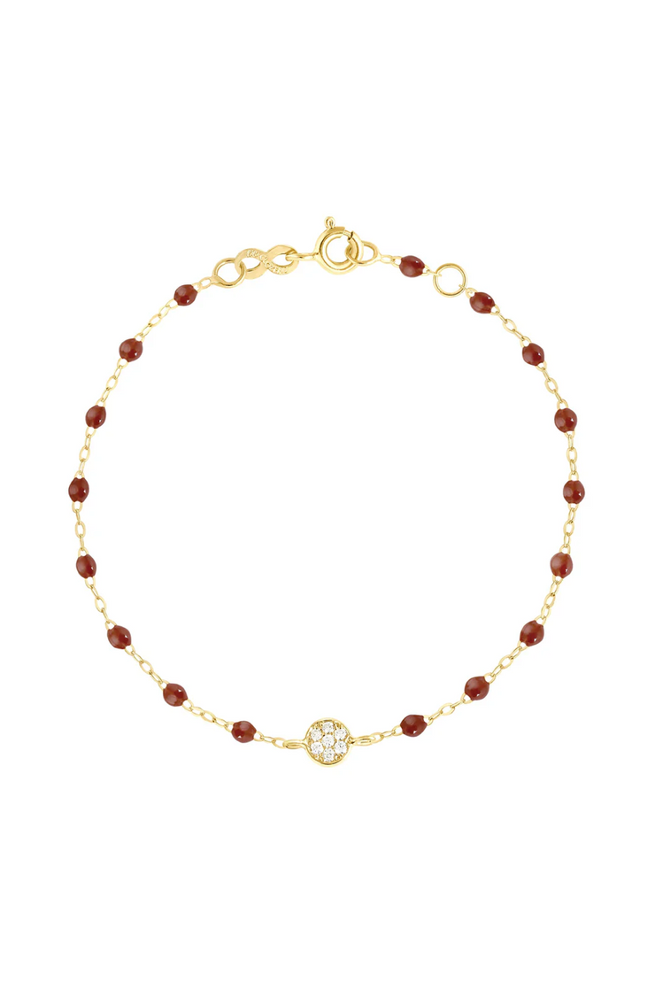 Gold bracelet with moka beads and diamonds on a white background