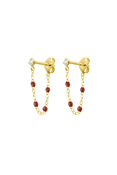 Gold chain earrings with moka beads on a white background