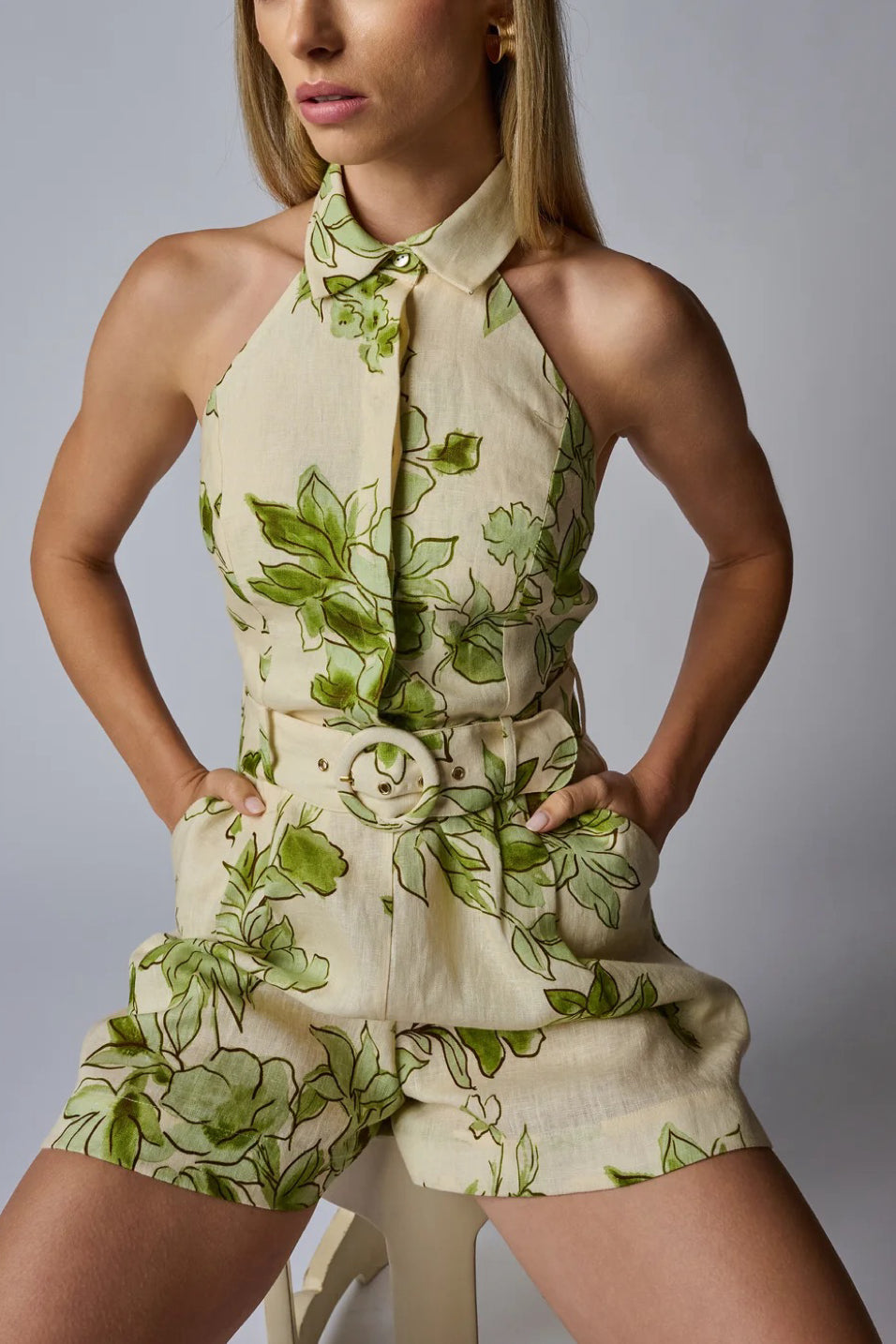 Image of model wearing the Hevron Asha Romper front view with hands in pockets