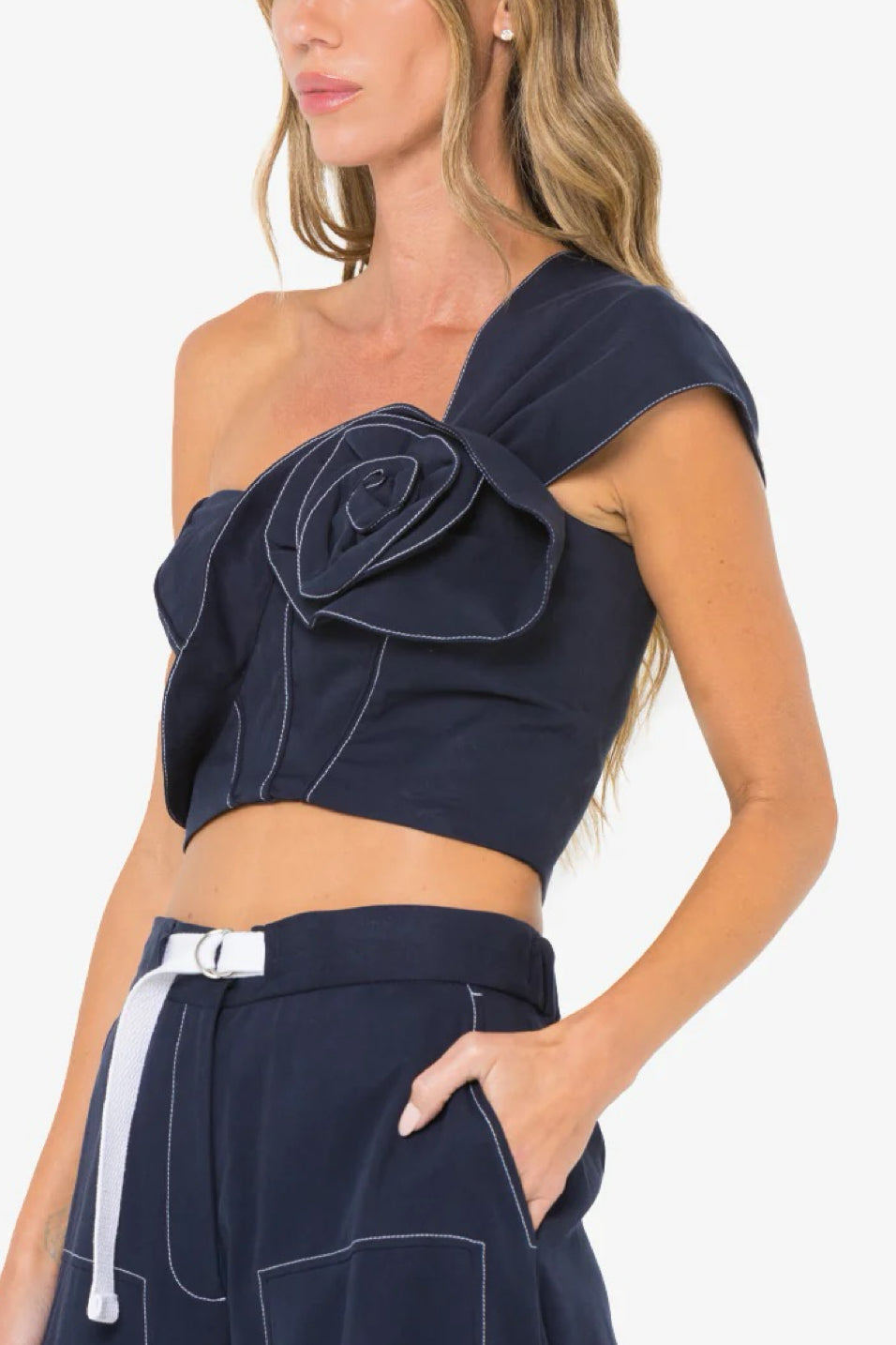 Image of model wearing the Hevron Blaire Top side angled view