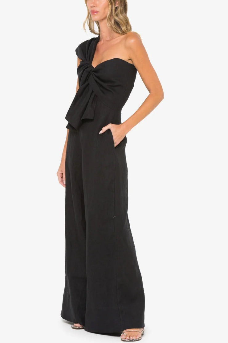 Image of model wearing the Hevron Eden Jumpsuit side view