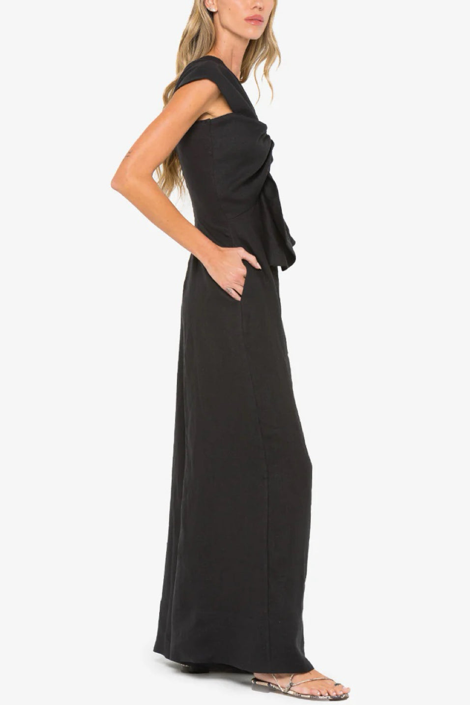 Image of model wearing the Hevron Eden Jumpsuit side view