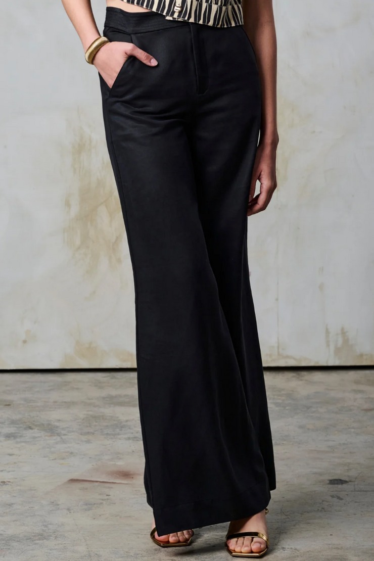 Image of model wearing Hevron black Erris pant