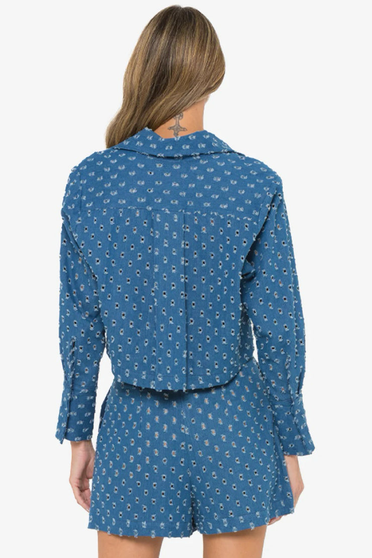 Image of model wearing the Hevron Pepper Top back view