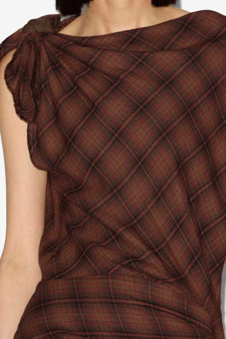 Plaid dress with a bow detail on a plain background