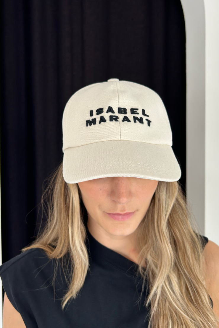 Image of model wearing Isabel Marant Tyron cap in ecru