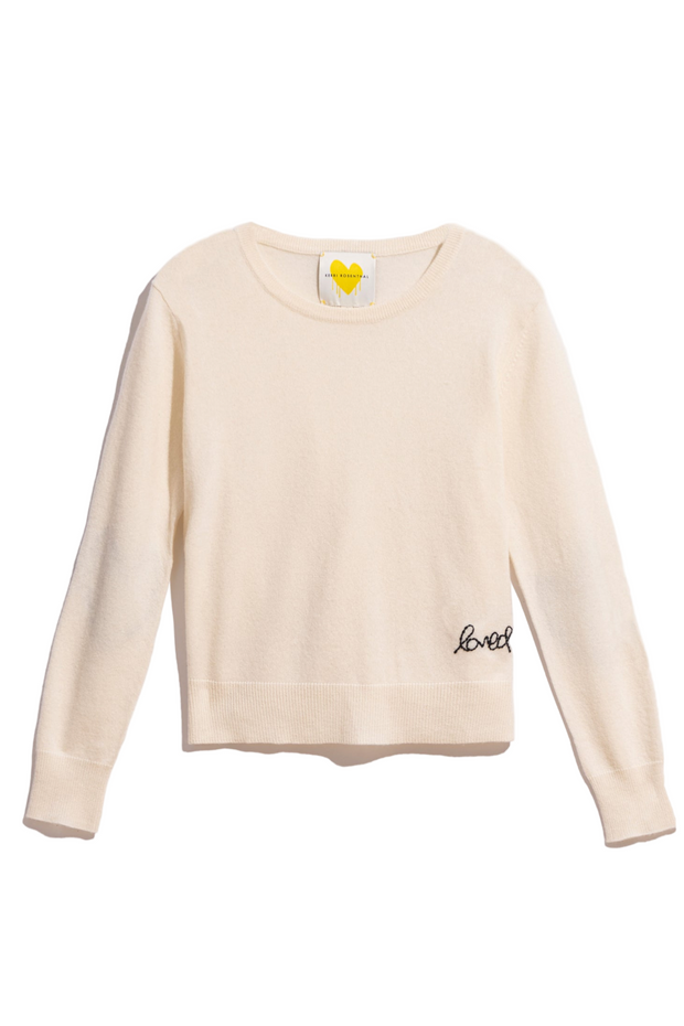 Cashmere sweater with 'love' embroidery on a white background