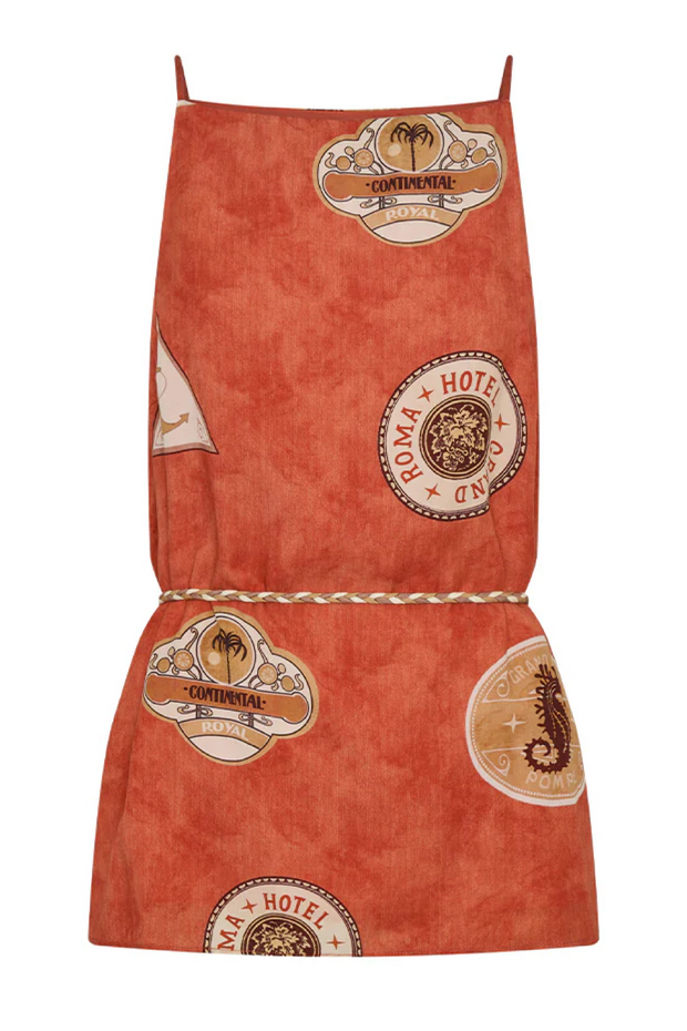 Red apron with vintage-style hotel logo patterns on a white background